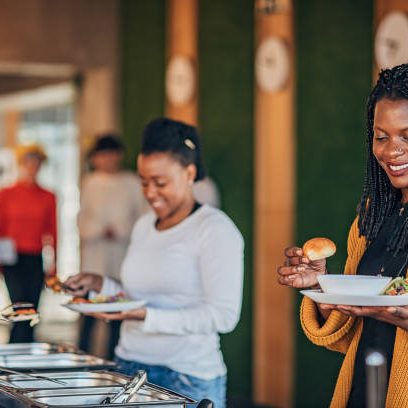 Group of multi ethnic business people on lunch break together in the firm's buffet.